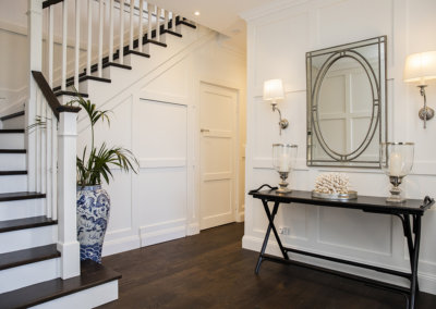 Hamptons style addition with timber staircase and entrance